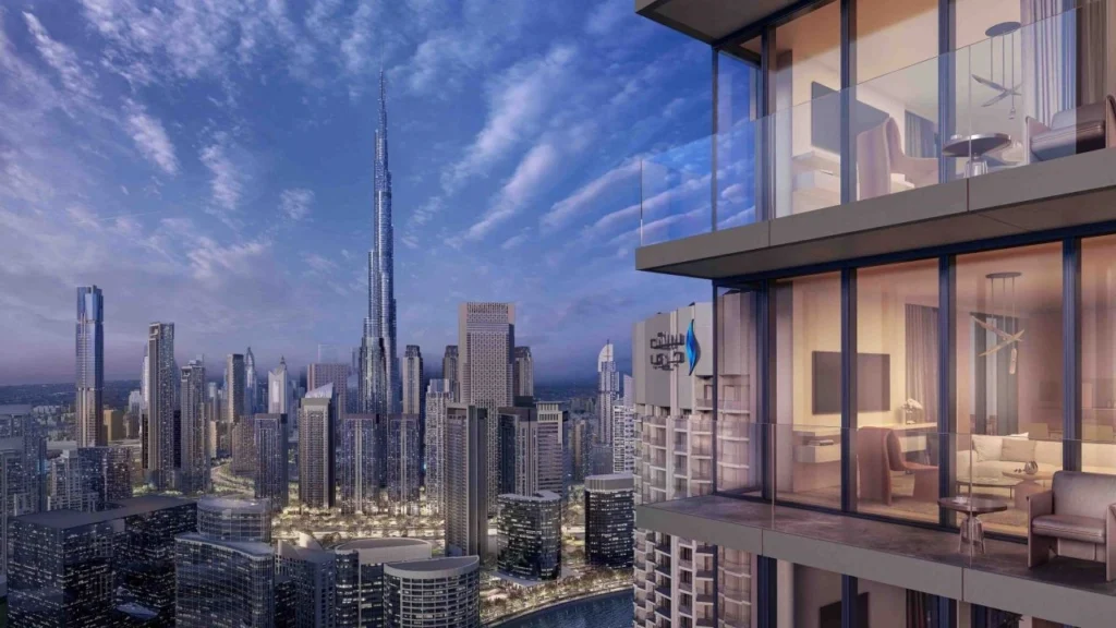A render of a landscaped pool courtyard flanked by two Emaar residential towers with the Burj Khalifa perfectly framed at the vanishing point. Emaar is one of the developers with a verifiable completed project history that directly mitigates the risks of buying property in Dubai — their mandatory RERA escrow accounts, milestone-based payment releases, and DLD registration make them a benchmark for lower-risk off-plan investment.