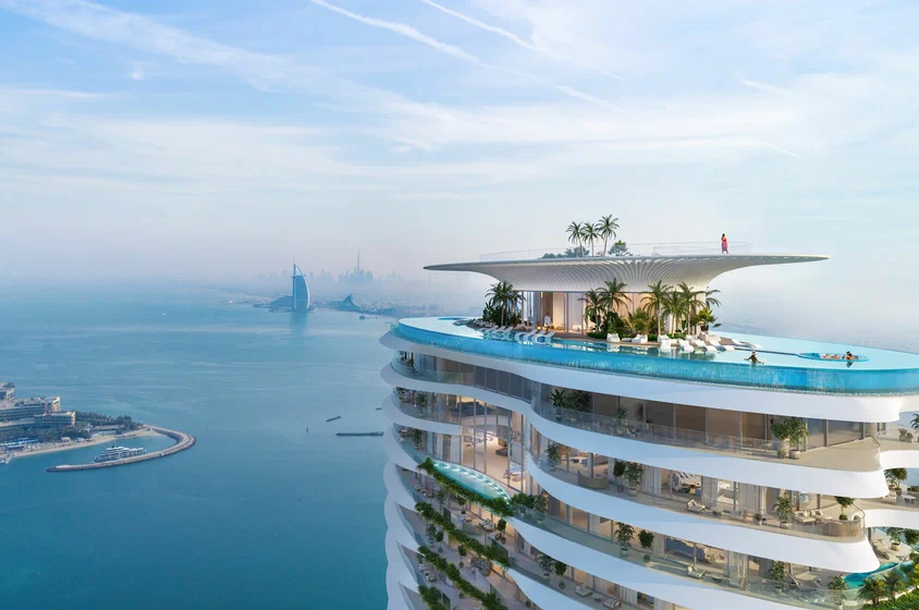 Six Senses Residences Palm Jumeirah rooftop infinity pool with Burj Al Arab view &mdash; benefits of buying property in Dubai for Indian investors